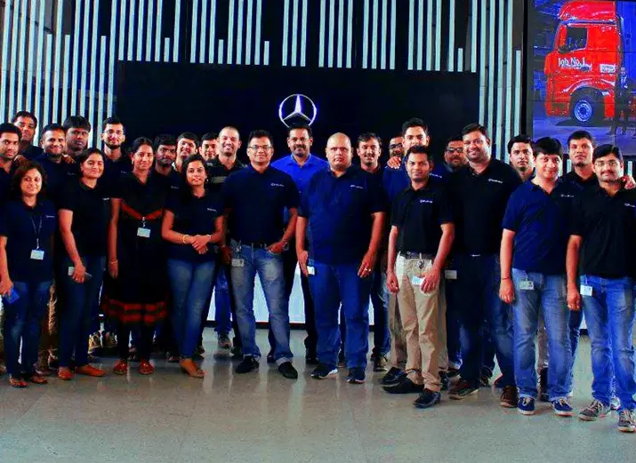 Mercedes employees wearing Navy Blue Cotton Polo Shirts with mercedes logo embroidered - Delivered in 